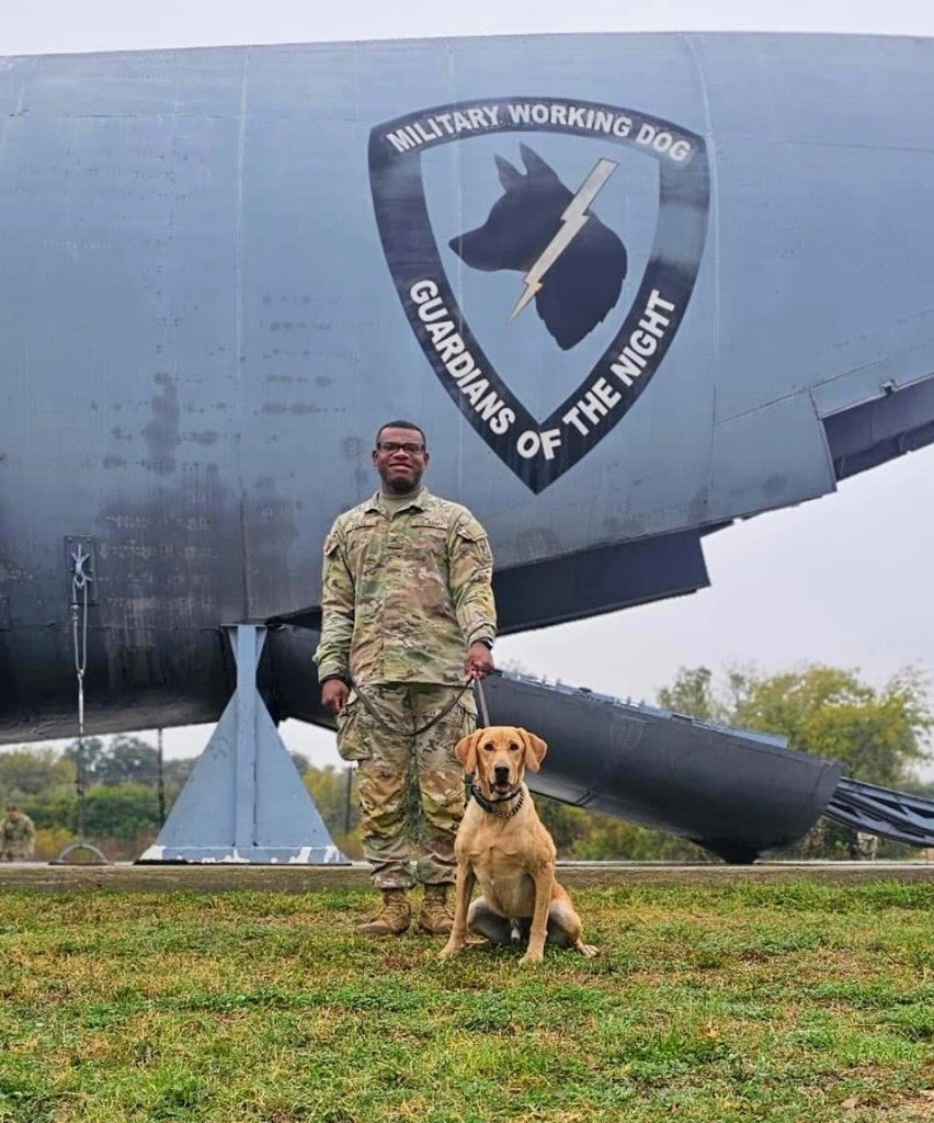 Ron-El Eugene Fultz, Jr. with a military working dog