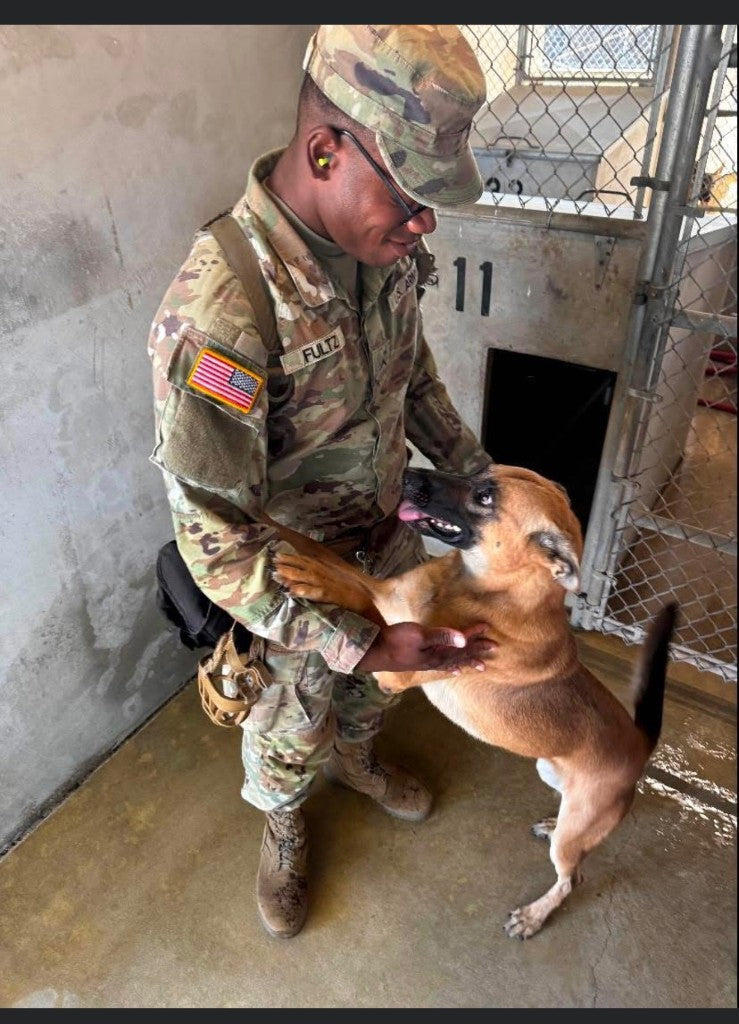 Ron-El Eugene Fultz, Jr. with a military working dog