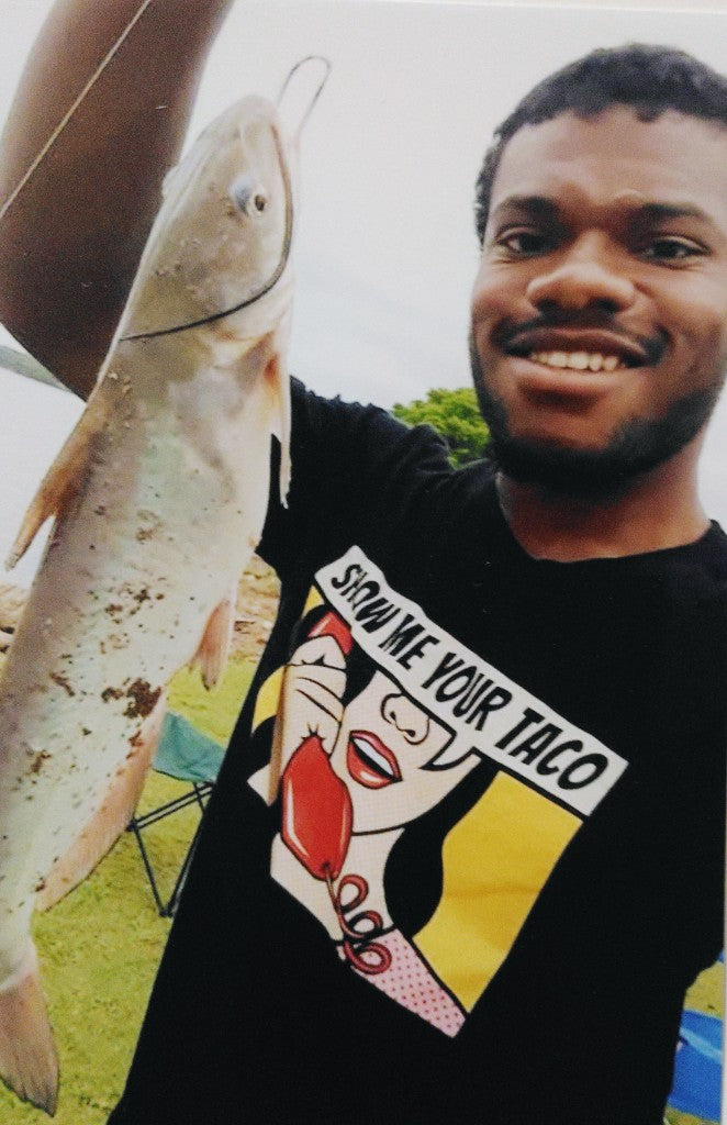 Ron-El Eugene Fultz, Jr. holding a fish he caught